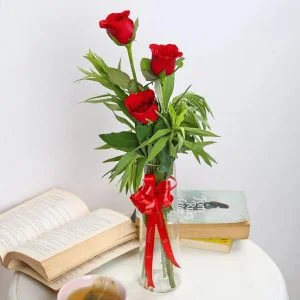 3 roses in a glass vase